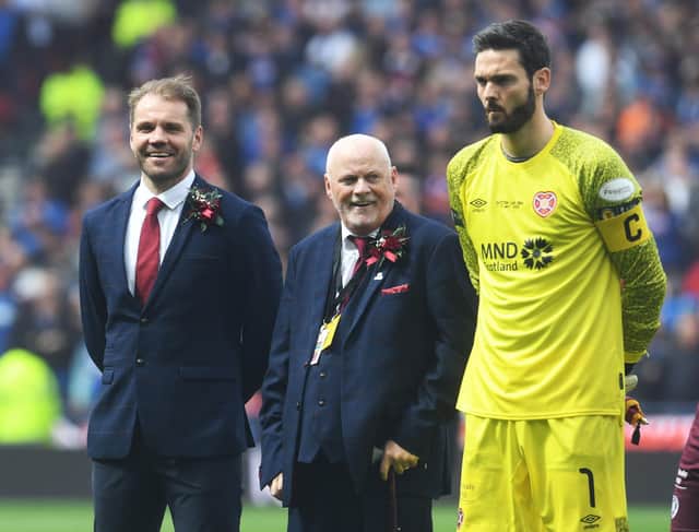 Lifelong Heart of Midlothian supporter, Stevie Morris, with Robbie Neilson and Craig Gordon during the Scottish Cup Final match between Rangers and Hearts at Hampden Park.