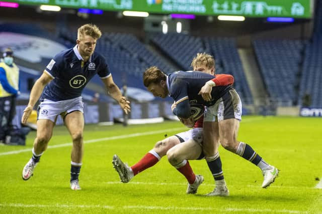 Scotland's Stuart Hogg runs through for his second try.