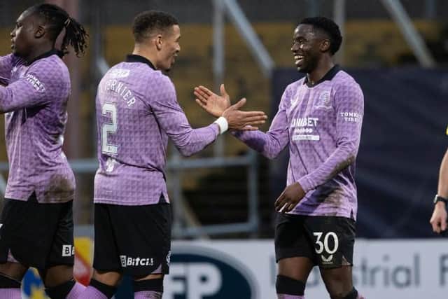 Fashion Sakala (right) is congratulated by James Tavernier after scoring Rangers' third goal in their 3-0 Scottish Cup quarter-final win at Dundee.  (Photo by Alan Harvey / SNS Group)