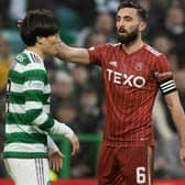 Celtic's Kyogo Furuhashi with Aberdeen's Graeme Shinnie  after his demanded to enter the fray late on. (Photo by Craig Williamson / SNS Group)