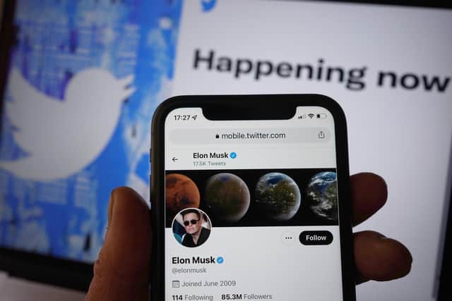 The Twitter social media app running on a mobile phone in London, as government and business accounts on Twitter could face "a slight cost" to stay on the social media platform, Elon Musk has said.