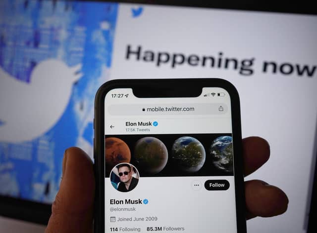 The Twitter social media app running on a mobile phone in London, as government and business accounts on Twitter could face "a slight cost" to stay on the social media platform, Elon Musk has said.