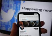 The Twitter social media app running on a mobile phone in London, as government and business accounts on Twitter could face "a slight cost" to stay on the social media platform, Elon Musk has said.