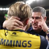 Nick Montgomery celebrates with Jason Cummings after guiding Central Coast Mariners to victory in the A-League Grand Final in June. (Photo by Cameron Spencer/Getty Images)