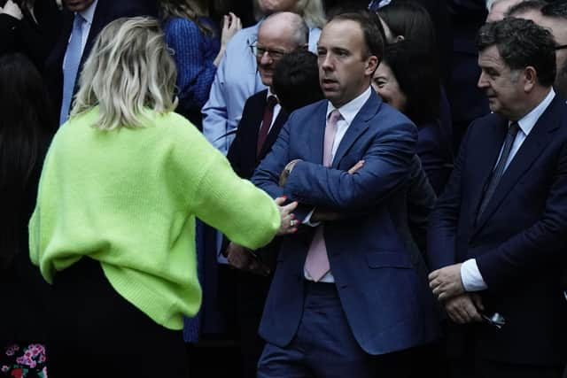 Matt Hancock, alongside other members of Conservative Party, waits outside the party headquarters in Westminster, London, for the arrival of Rishi Sunak, the new leader of the Conservative party.