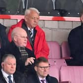 Raith Rovers owner John Sim (in red) watches on during the recent SPFL Trust Trophy final win over Queen of the South at the Penny Cars Stadium, Airdrie.  (Photo by Paul Devlin / SNS Group)