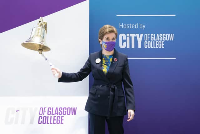 First Minister Nicola Sturgeon rings the college bell to officially open the City of Glasgow College's International Maritime Hub. The First Minister has not ruled out a return of Covid restrictions after COP26. Picture: Jane Barlow/PA Wire