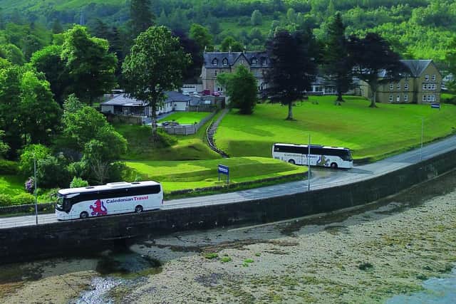 Coaches leaving the Caledonian Claymore Hotel.