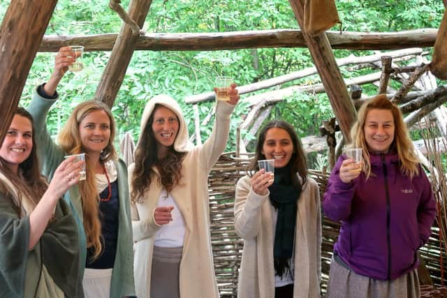 Staff celebrating the news of the redevelopment of the Scottish Crannog Centre. PIC: Contributed.