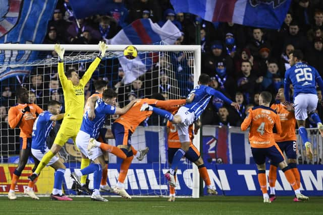 Chris Stokes heads home Kilmarnock's opener against Rangers. (Photo by Rob Casey / SNS Group)