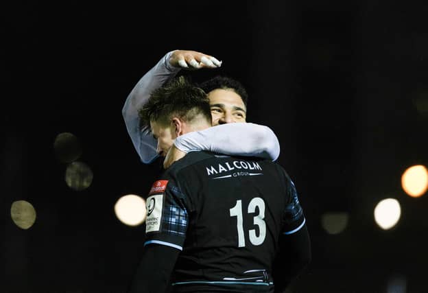 Glasgow Warriors' Huw Jones celebrates with Sione Tuipolotu after scoring a try in the win over Toulon.