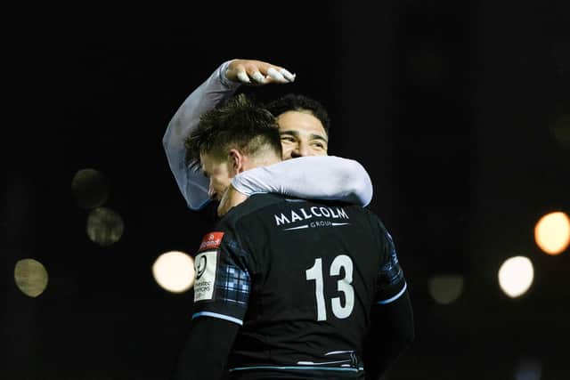 Glasgow Warriors' Huw Jones celebrates with Sione Tuipolotu after scoring a try in the win over Toulon.