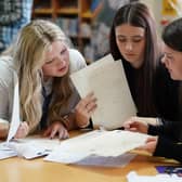 Pupils (L-R) Tess Worley, Abbie Hart and Leah Mathieson from Craigmount High School in Edinburgh look at their exam results during SQA results day in 2023. SQA strikes could impact the delivery of exam results next year. Picture: Andrew Milligan/PA Wire