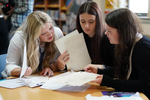 Pupils (L-R) Tess Worley, Abbie Hart and Leah Mathieson from Craigmount High School in Edinburgh look at their exam results during SQA results day in 2023. SQA strikes could impact the delivery of exam results next year. Picture: Andrew Milligan/PA Wire