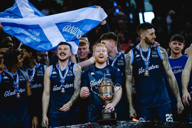 Caledonia Gladiators celebrate with the BBL Trophy after beating Cheshire Phoenix in the final. Picture: British Basketball League