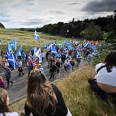 Pro-independence supporters hold a march and rally outside the Scottish Parliament