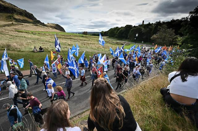 Pro-independence supporters hold a march and rally outside the Scottish Parliament