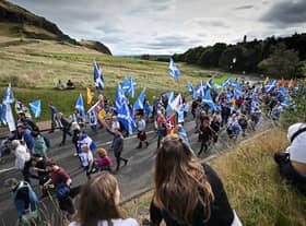 Pro-independence supporters hold a march and rally outside the Scottish Parliament