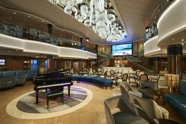 The Norwegian Jade Atrium offers entertainment, along with guest services and a coffee shop