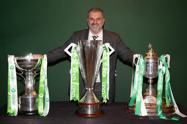 Departed Celtic manager Ange Postecoglou with the three Scottish trophies - Premiership, League Cup and Scottish Cup - after landing a domestic treble. (Photo by Craig Williamson / SNS Group)