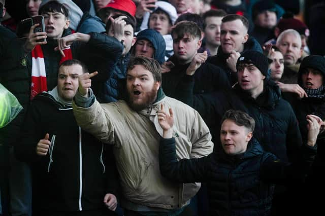 Unhappy Aberdeen fans at full-time at Fir Park after their fans crashed out of the Scottish Cup  (Photo by Craig Foy / SNS Group)