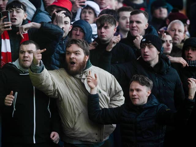 Unhappy Aberdeen fans at full-time at Fir Park after their fans crashed out of the Scottish Cup  (Photo by Craig Foy / SNS Group)