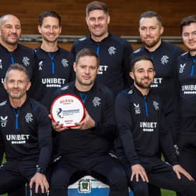 Rangers boss Michael Beale poses with the cinch Premiership Manager of the Month award for December alongside his backroom staff. (Photo by Rob Casey / SNS Group)