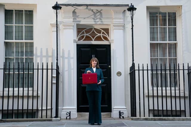 Chancellor of the Exchequer Rachel Reeves poses outside 11 Downing Street, London, with her ministerial red box.