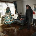 Carol Watters inspects flood damage to her home in Cupar caused by Storm Gerrit (Picture: Jeff J Mitchell/Getty Images)