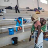 Displaced women from Palma are seen at the Pemba Sports center on April 2 where people were evacuated from the coasts of Palma after armed insurgents attacked the city on March 24. (Getty Images)