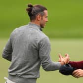 Rory McIlroy shakes hands with Gareth Bale after playing together in the pro-am prior to the BMW PGA Championship at Wentworth Club. Picture: Andrew Redington/Getty Images.