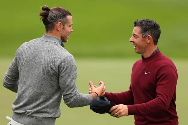 Rory McIlroy shakes hands with Gareth Bale after playing together in the pro-am prior to the BMW PGA Championship at Wentworth Club. Picture: Andrew Redington/Getty Images.