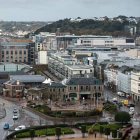 Office and residential buildings are pictured in front of the beach and seafront in St Helier, on the British island of Jersey (Photo: Oli Scarff/AFP via Getty Images).