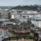 Office and residential buildings are pictured in front of the beach and seafront in St Helier, on the British island of Jersey (Photo: Oli Scarff/AFP via Getty Images).