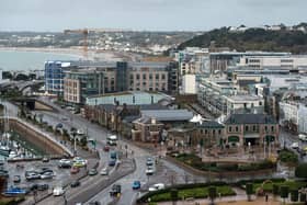 Office and residential buildings are pictured in front of the beach and seafront in St Helier, on the British island of Jersey (Photo: Oli Scarff/AFP via Getty Images).