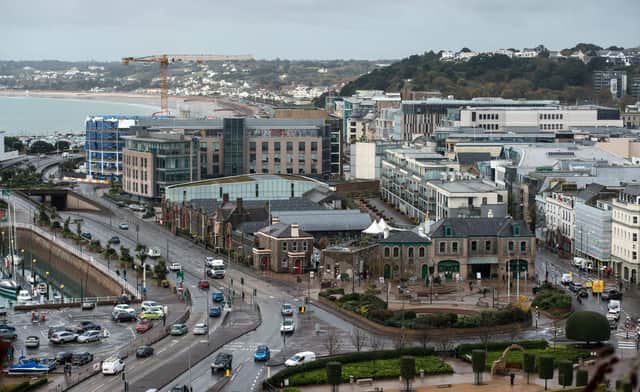 Office and residential buildings are pictured in front of the beach and seafront in St Helier, on the British island of Jersey (Photo: Oli Scarff/AFP via Getty Images).