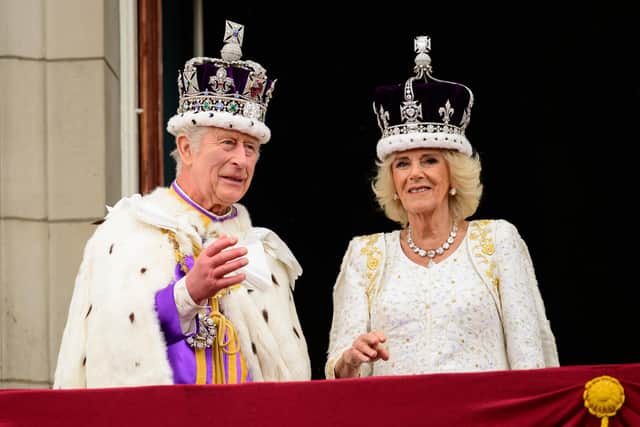 King Charles III and Queen Camilla on the balcony of Buckingham Palace, London, following the coronation.