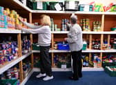 Giving to any charity, for instance foodbanks, above, allows it to claim an extra 25p for every £1 you give.