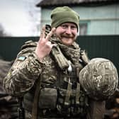 A Ukrainian soldier flashes a V-for-victory sign during the defence of Kyiv in March last year (Picture: Aris Messinis/AFP via Getty Images)