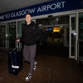Hibs' Kevin Nisbet arrives at Glasgow Airport after a proposed move to Millwall broke down.