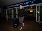Hibs' Kevin Nisbet arrives at Glasgow Airport after a proposed move to Millwall broke down.