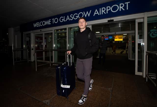 Hibs' Kevin Nisbet arrives at Glasgow Airport after a proposed move to Millwall broke down.