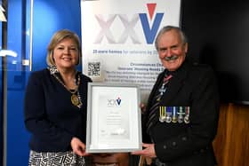 Aberdeenshire Provost Judy Whyte receives a framed certificate from VHS chairman, Group Captain Bob Kemp, in recognition of the council's support. Image: Veterans Housing Scotland