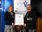 Aberdeenshire Provost Judy Whyte receives a framed certificate from VHS chairman, Group Captain Bob Kemp, in recognition of the council's support. Image: Veterans Housing Scotland