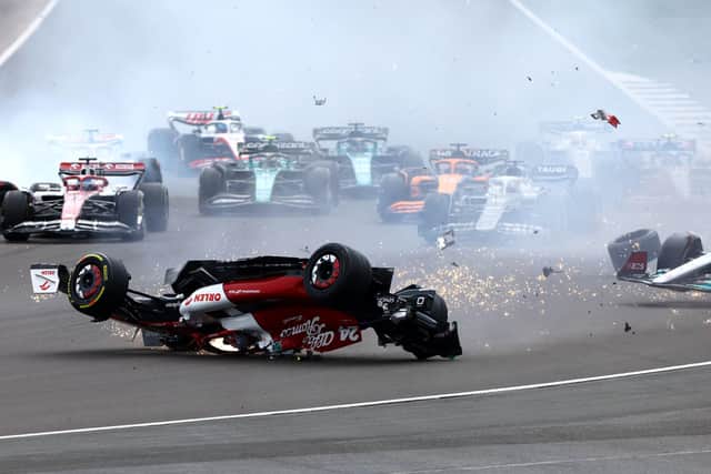 Zhou Guanyu of China driving the (24) Alfa Romeo F1 C42 Ferrari crashes at the start during the F1 Grand Prix of Great Britain at Silverstone. (Photo by Mark Thompson/Getty Images)
