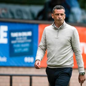 Sacked Dundee United manager Jack Ross walks down the touchline following the 9-0 defeat to Celtic on Sunday. (Photo by Paul Devlin / SNS Group)