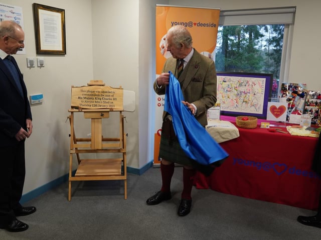 The plaque marks Charles' visit.