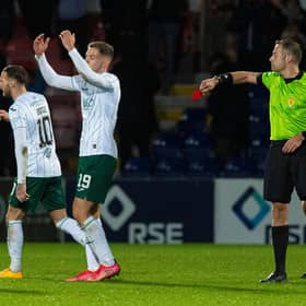 Hibs' Martin Boyle is shown a red card by referee Gavin Duncan.