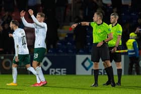 Hibs' Martin Boyle is shown a red card by referee Gavin Duncan.
