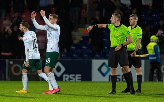 Hibs' Martin Boyle is shown a red card by referee Gavin Duncan.